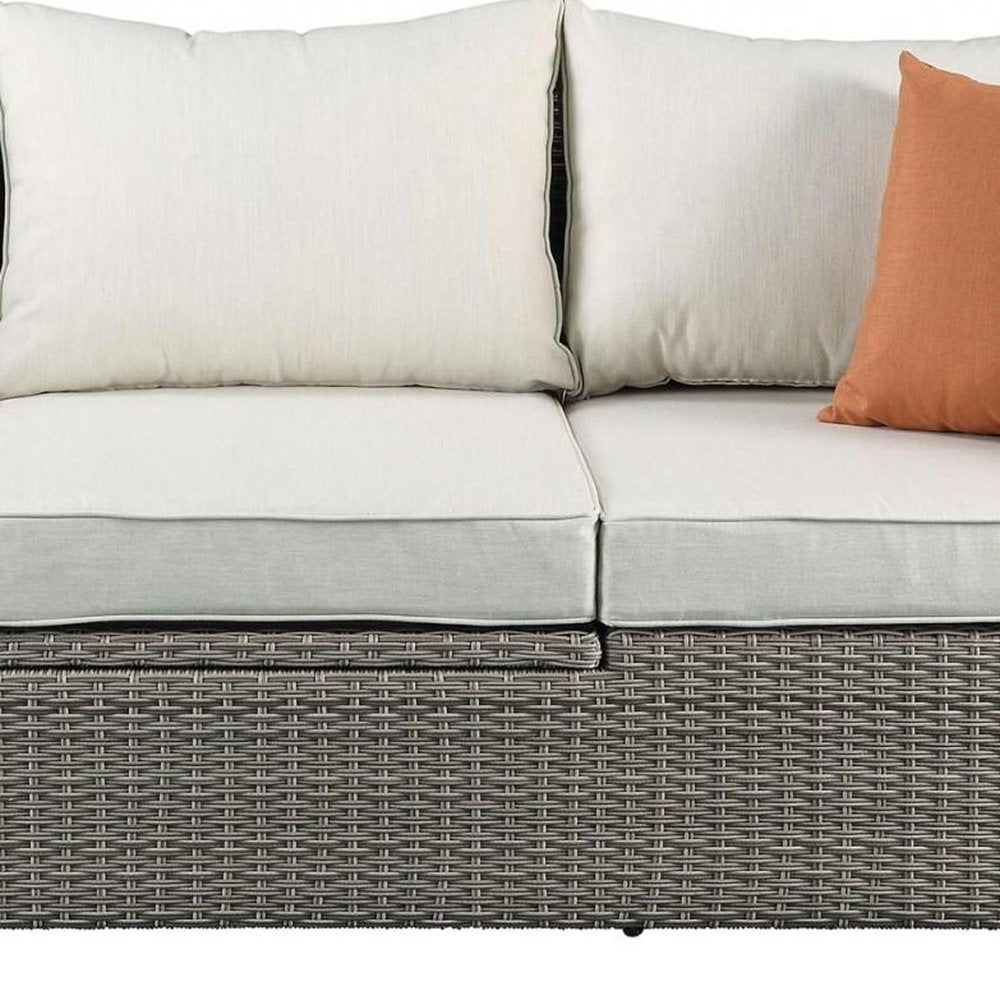 Three Piece Outdoor Gray Wicker Sectional Seating Group with Beige Cushions
