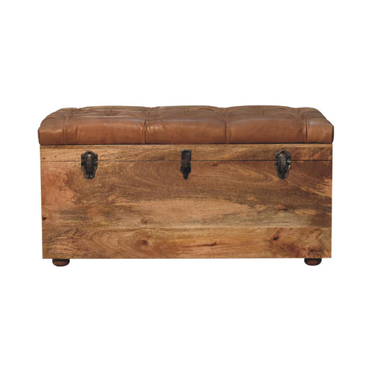 Front view of a western-style leather storage trunk, showcasing its solid mango wood frame and country-inspired buffalo hide seat.