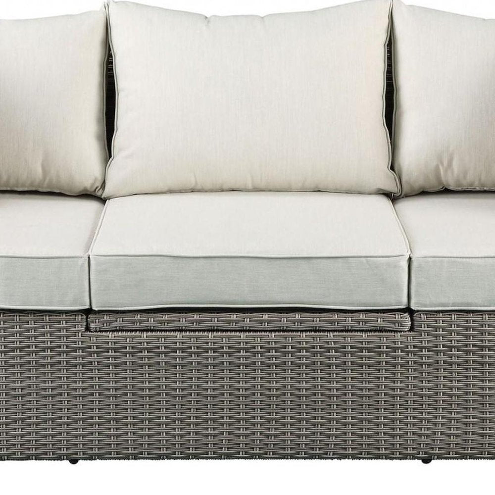 Three Piece Outdoor Gray Wicker Sectional Seating Group with Beige Cushions
