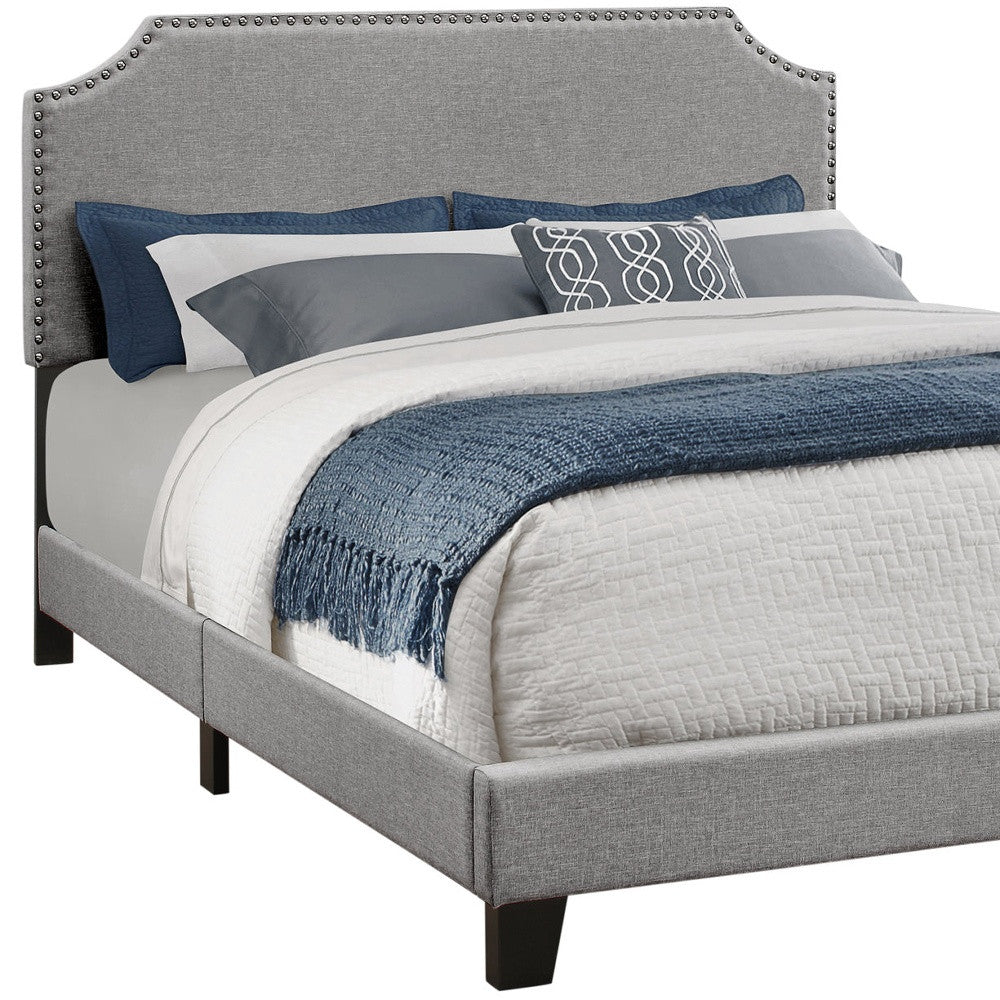 Beige Standard Bed Upholstered With Nailhead Trim And With Headboard