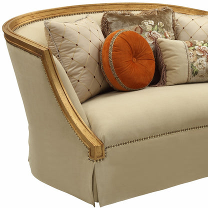 70" Tan And Gold Curved Loveseat and Toss Pillows