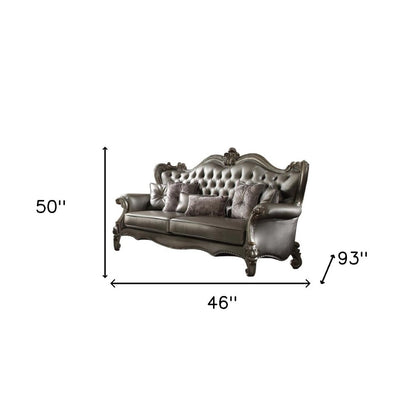 46" Platinum Faux Leather Curved Sofa And Toss Pillows