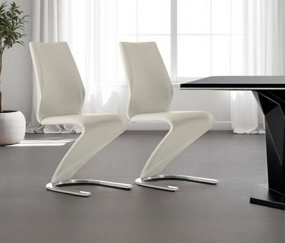 Set of Two White and Silver Upholstered Faux Leather Dining Side Chairs