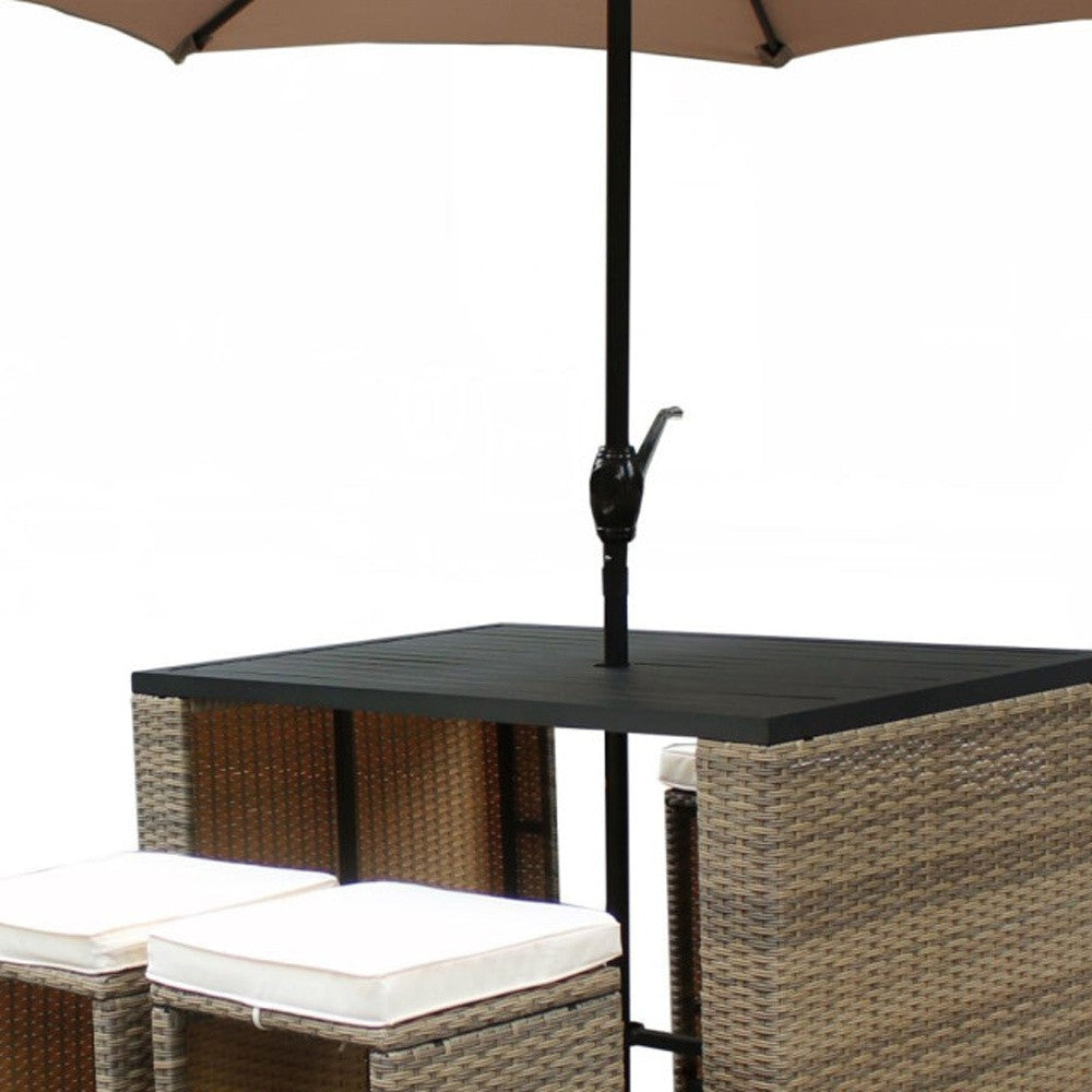 Six Piece Brown and Tan Faux Wicker Outdoor Bar Height Table Set with Umbrella and Stools