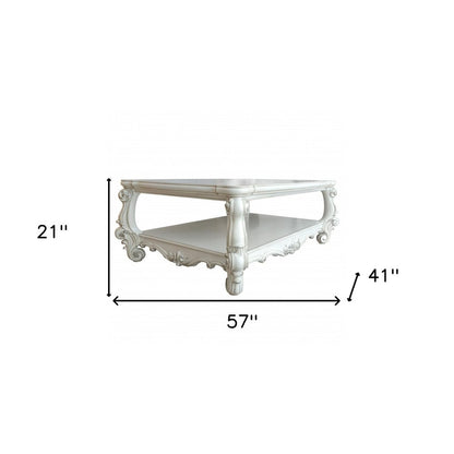 57" Antiqued White Wood Coffee Table With Shelf