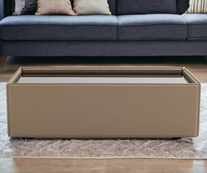 44" Beige And Black Faux Leather and Glass Rectangular Coffee Table