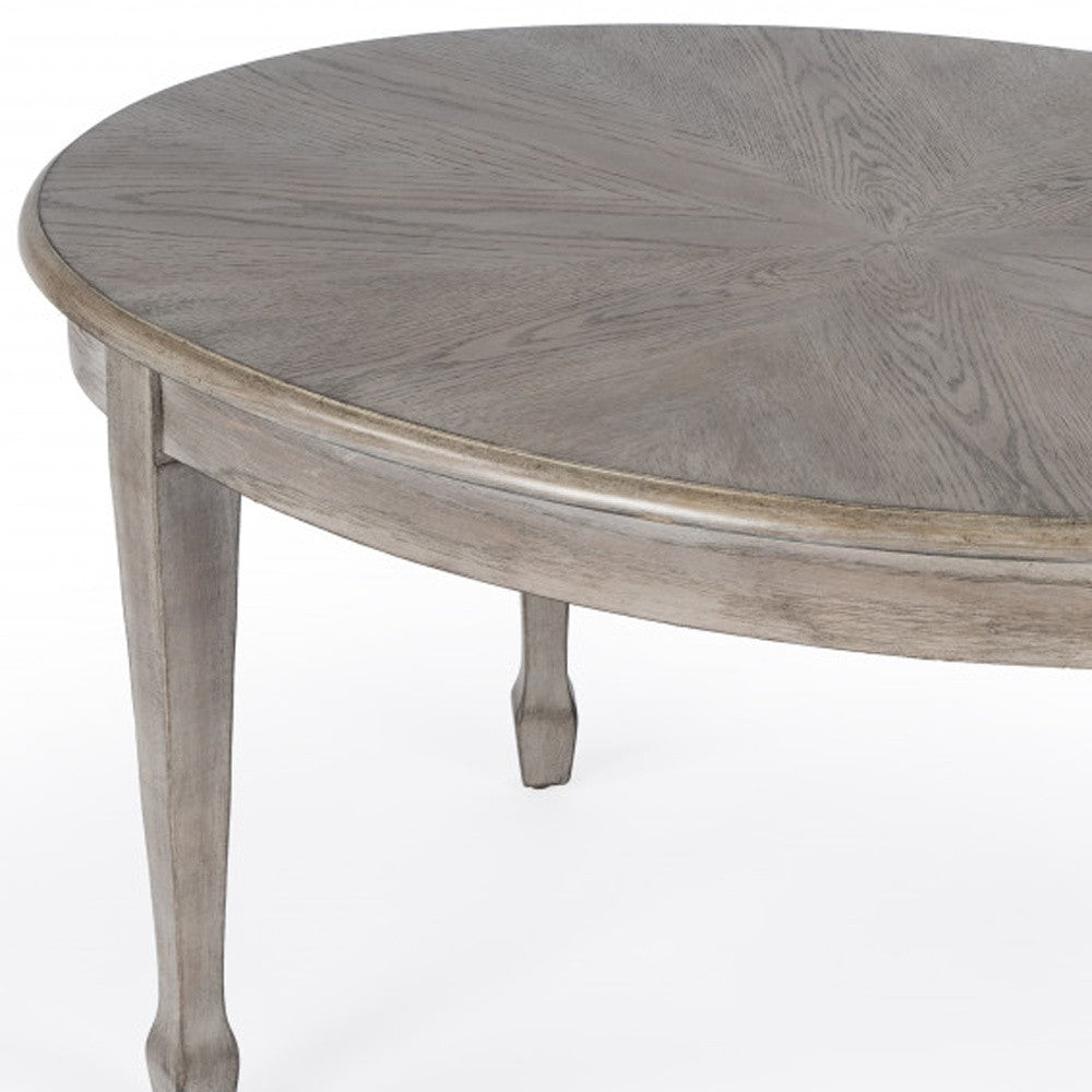 38" Natural Solid And Manufactured Wood Oval Distressed Coffee Table