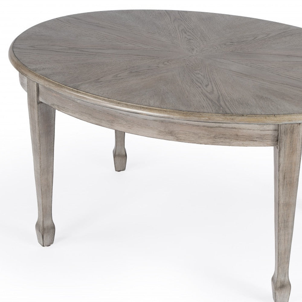 38" Natural Solid And Manufactured Wood Oval Distressed Coffee Table