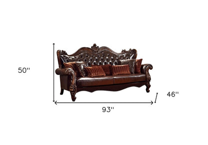 93" Brown Faux Leather Sofa And Toss Pillows With Burgundy Legs