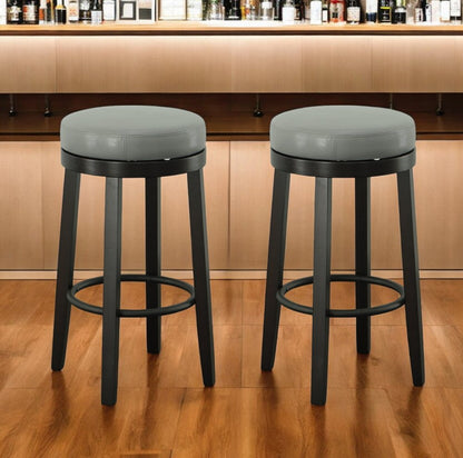 Set of Two 30" Gray and Espresso Faux Leather and Solid Wood Backless Bar Height Swivel Bar Chairs