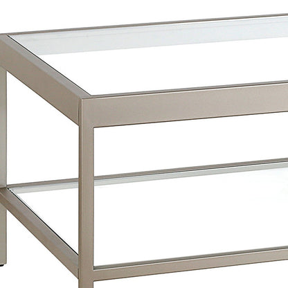 54" Clear And Silver Glass And Steel Coffee Table With Shelf