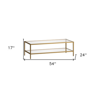 54" Clear And Gold Glass And Steel Coffee Table With Shelf