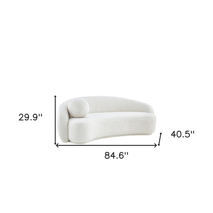 85" Cream Sherpa Curved Sofa And Toss Pillow With Legs